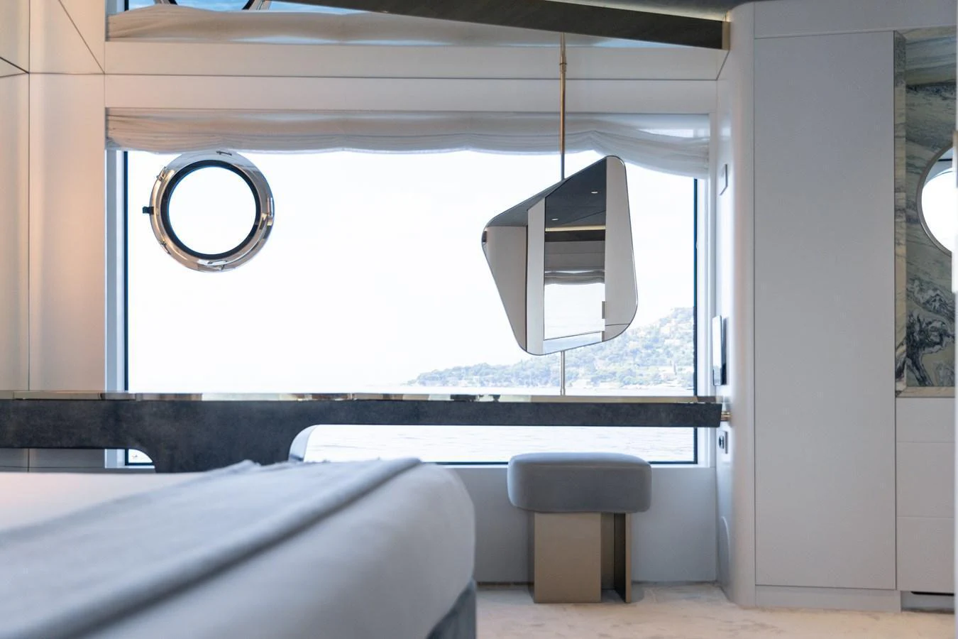 A luxurious stateroom with modern furnishings and large windows offering stunning sea views. aboard PALMAX Yacht for Sale