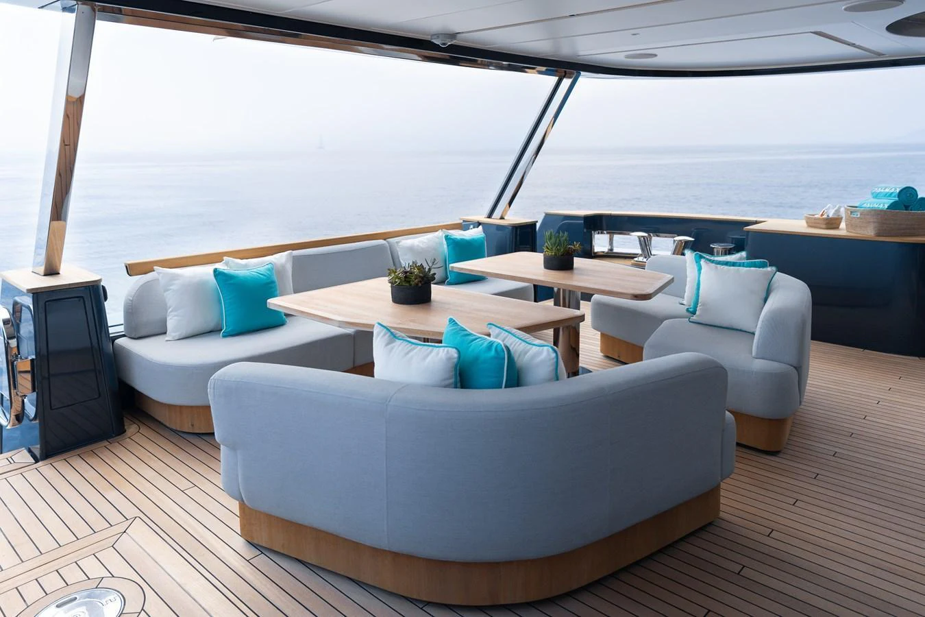 The aft deck features elegant seating arrangements with a stunning ocean view. aboard PALMAX Yacht for Sale