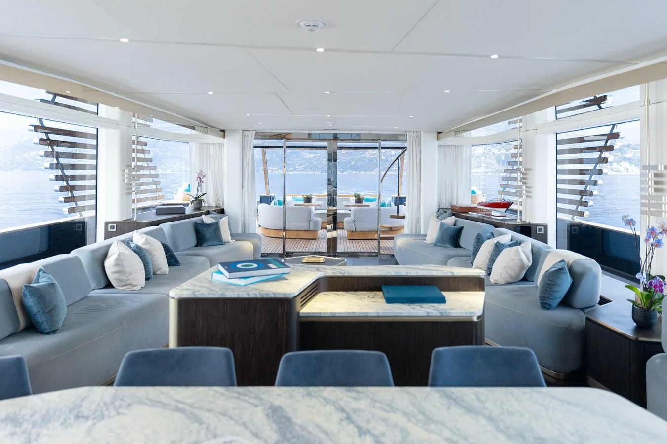 The spacious salon offers panoramic views and luxurious seating arrangements. aboard PALMAX Yacht for Sale