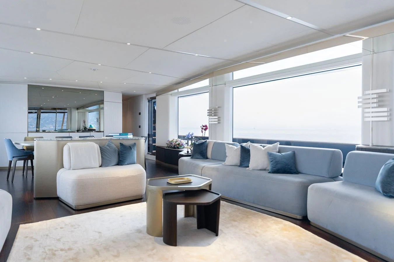 The salon features modern furnishings with expansive windows offering stunning sea views. aboard PALMAX Yacht for Sale