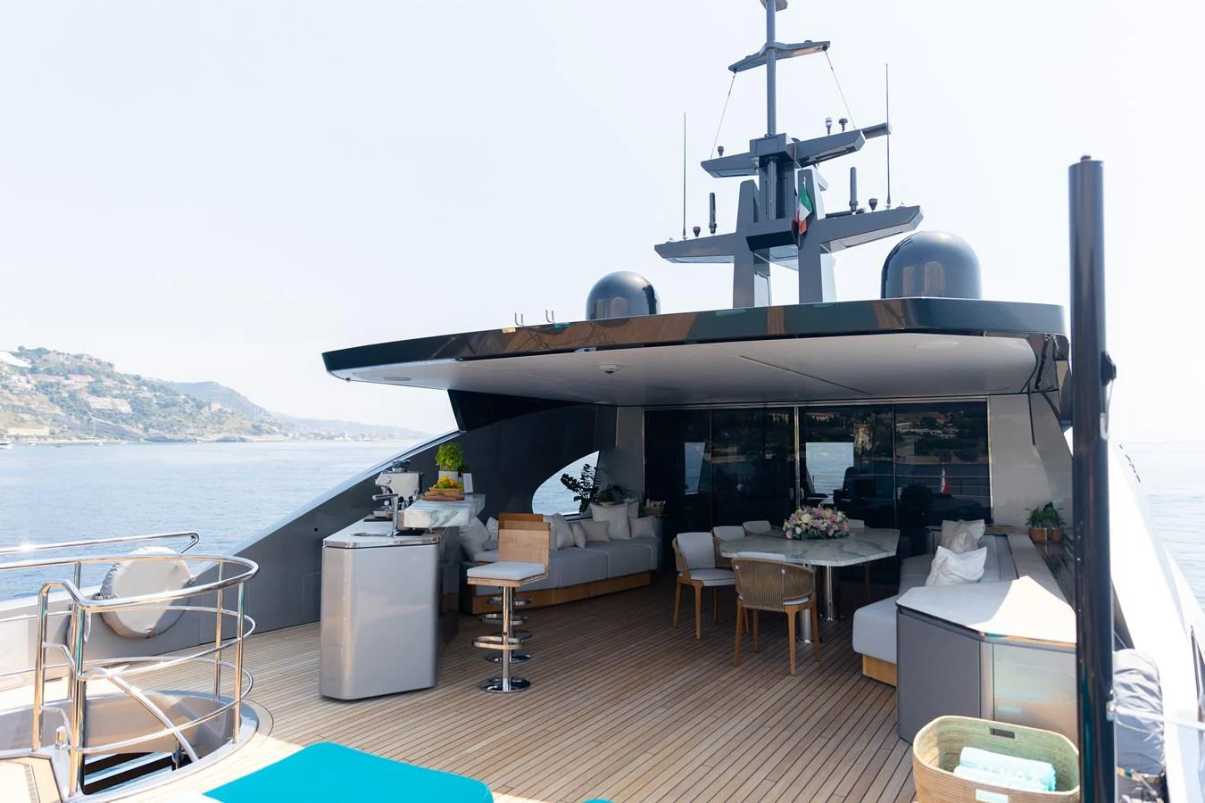 The aft deck offers a spacious and luxurious outdoor seating area with stunning views. aboard PALMAX Yacht for Sale