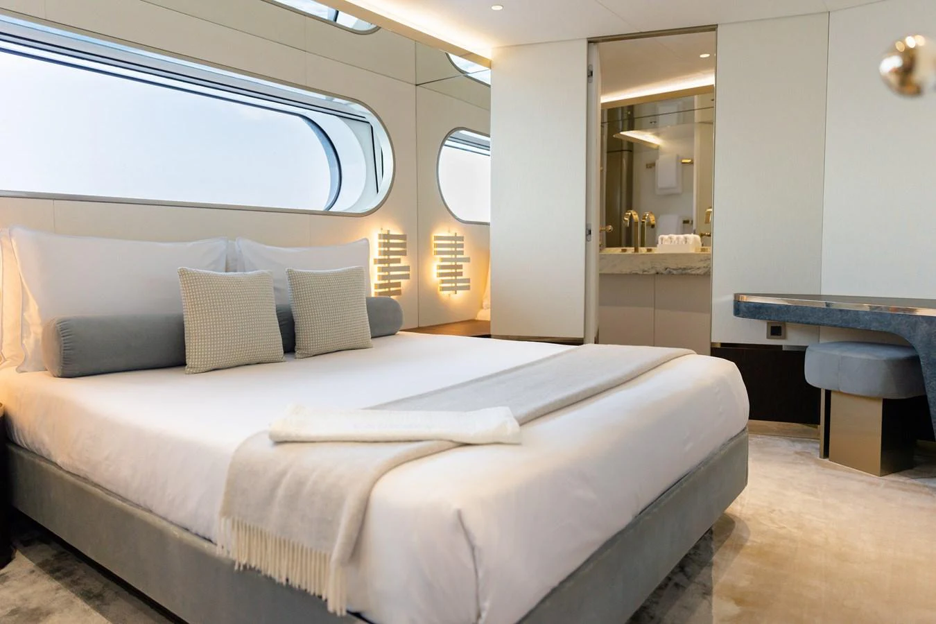 The master stateroom features a luxurious bed with elegant decor and ample natural light. aboard PALMAX Yacht for Sale
