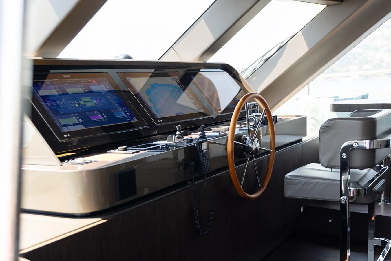 The helm station features advanced navigation systems and a sleek, modern design. aboard PALMAX Yacht for Sale