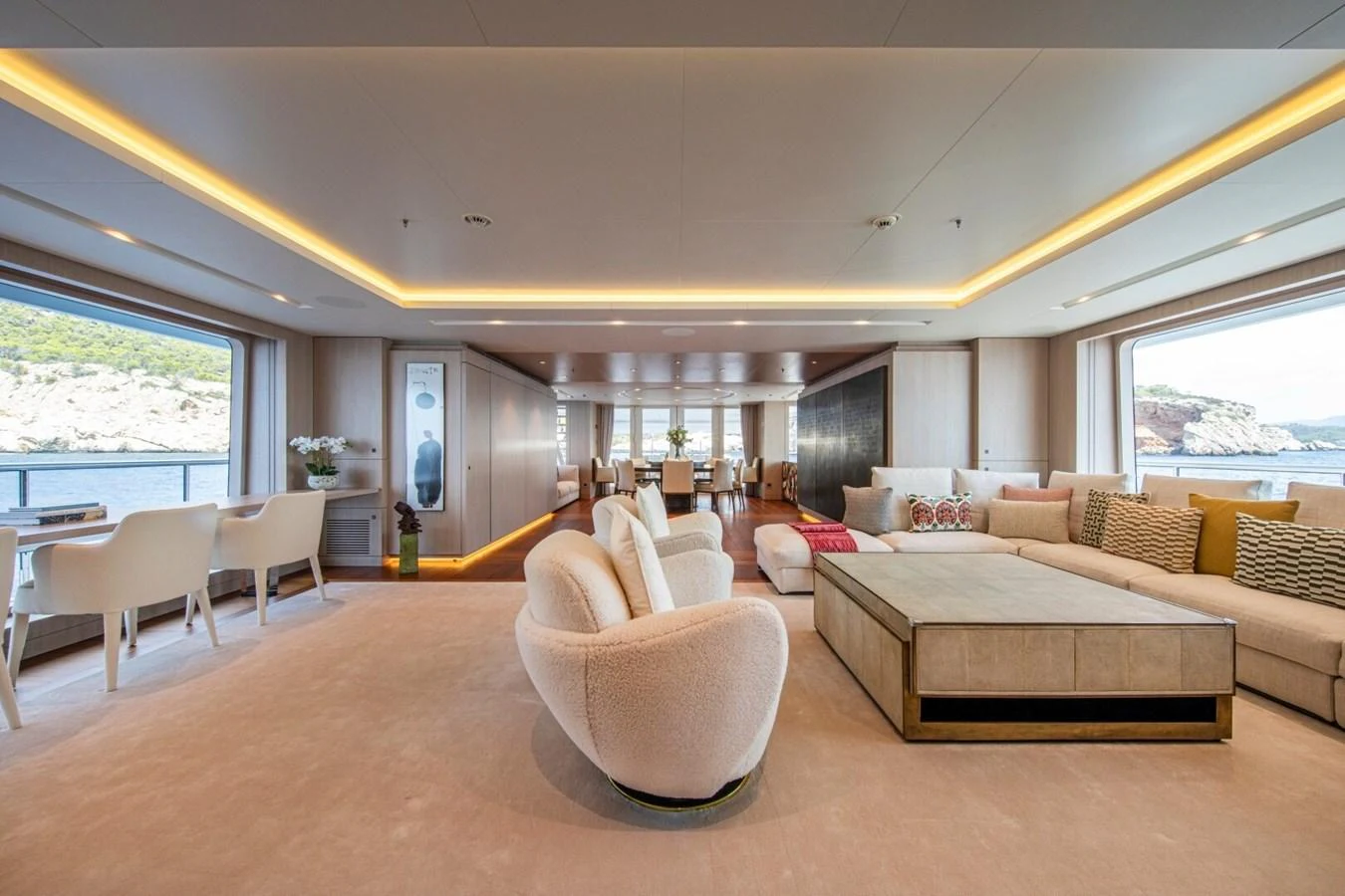 The spacious salon features luxurious seating and large windows offering stunning views. aboard PROMISE Yacht for Sale