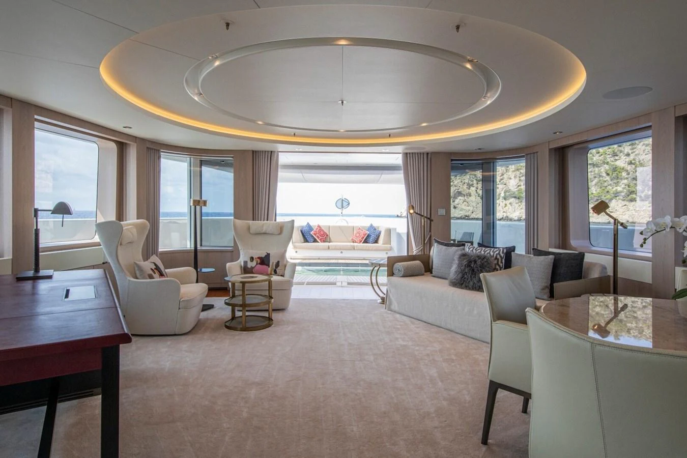 The salon features elegant seating with panoramic views and luxurious decor. aboard PROMISE Yacht for Sale