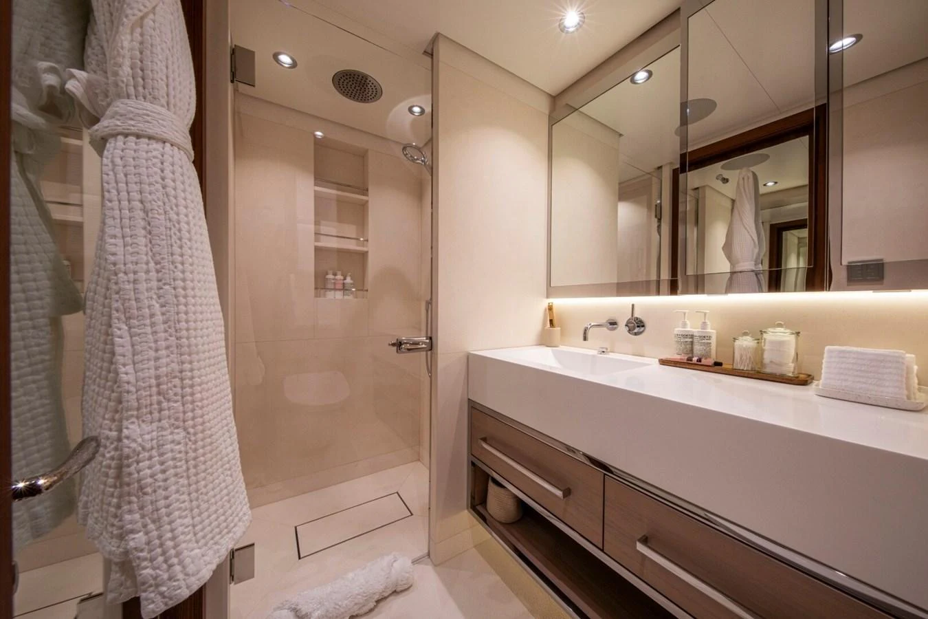 The yacht's bathroom features a modern design with a spacious shower and elegant fixtures. aboard PROMISE Yacht for Sale
