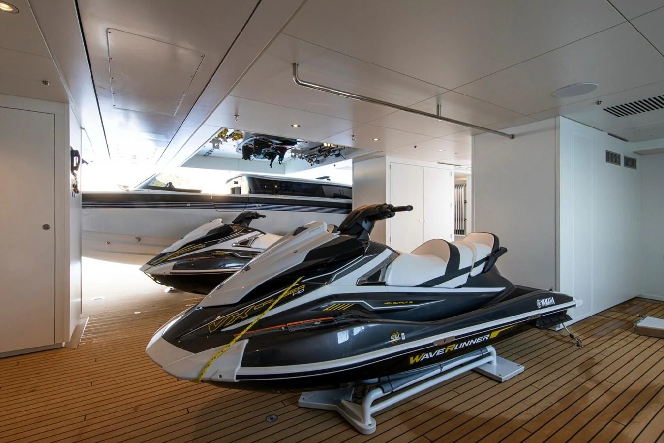 The yacht's garage houses sleek jet skis, ready for thrilling water adventures. aboard PROMISE Yacht for Sale