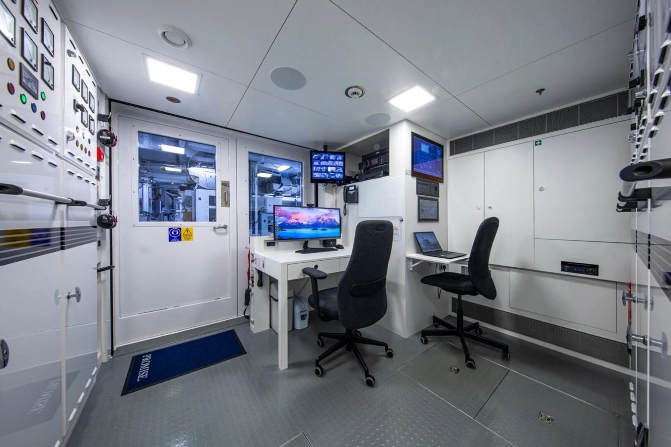 The yacht's control room is equipped with advanced monitoring systems and comfortable seating for operational efficiency. aboard PROMISE Yacht for Sale