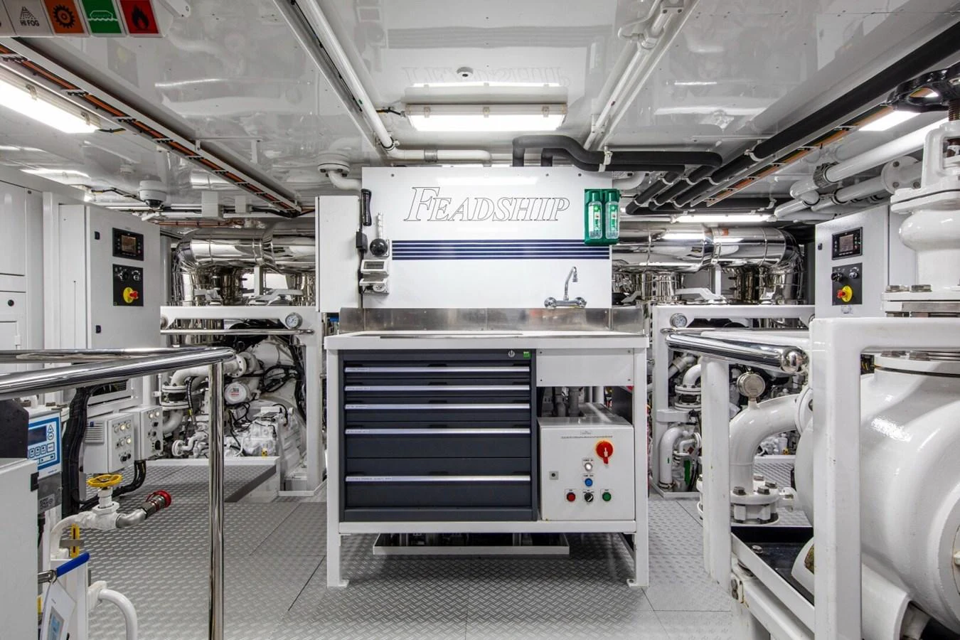 The engine room showcases a meticulously organized and well-equipped space with advanced machinery and tools. aboard PROMISE Yacht for Sale