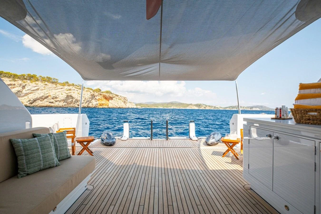 The aft deck offers a serene and inviting space with comfortable seating and stunning ocean views. aboard PROMISE Yacht for Sale