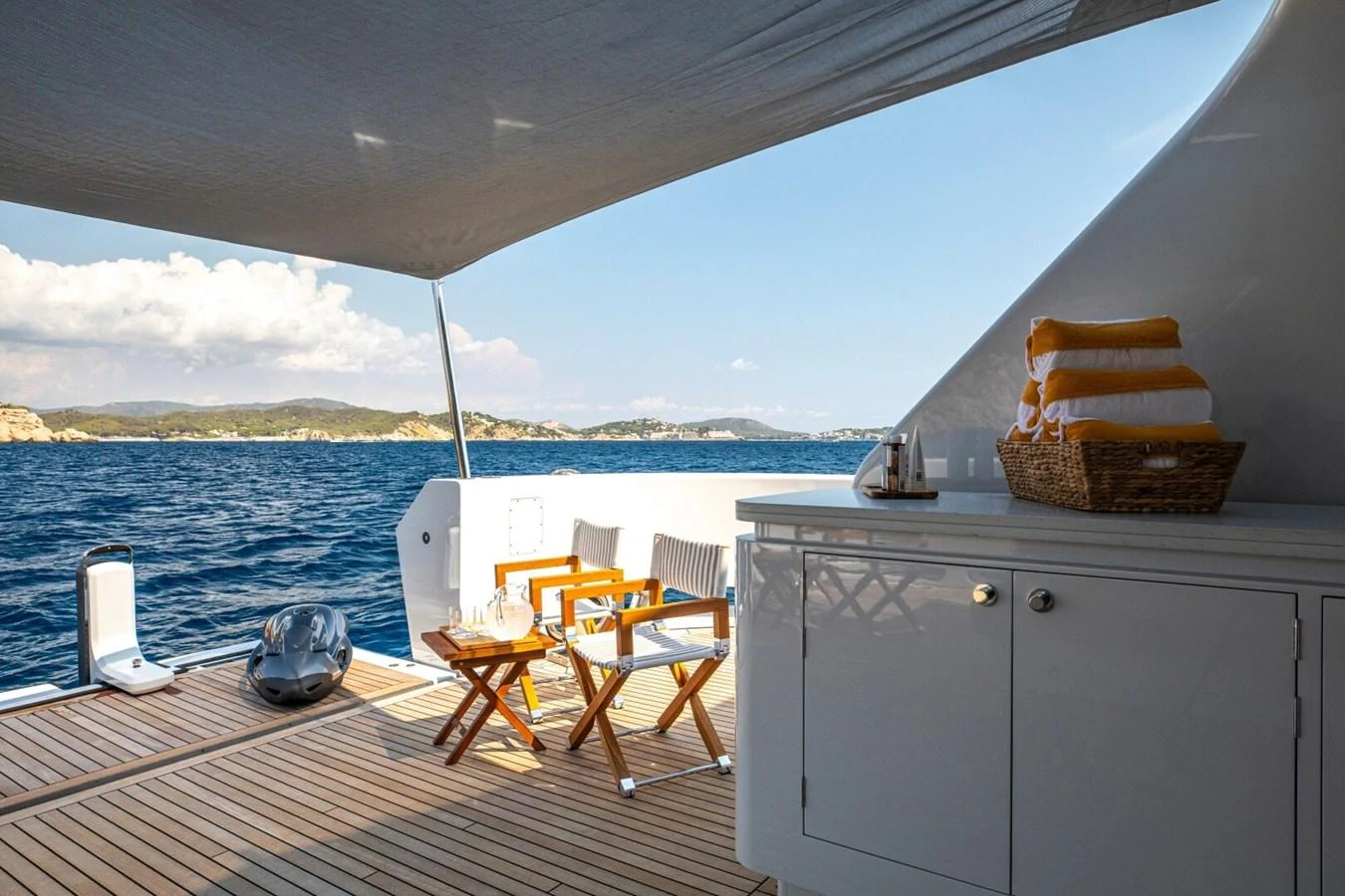 The aft deck offers a serene space with comfortable seating and stunning ocean views. aboard PROMISE Yacht for Sale