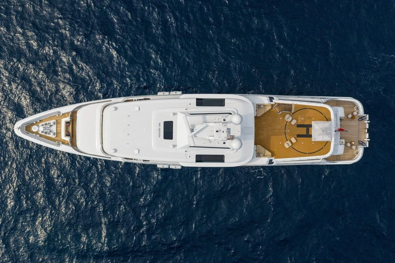 An aerial view of a luxurious yacht cruising on the open sea. aboard PROMISE Yacht for Sale