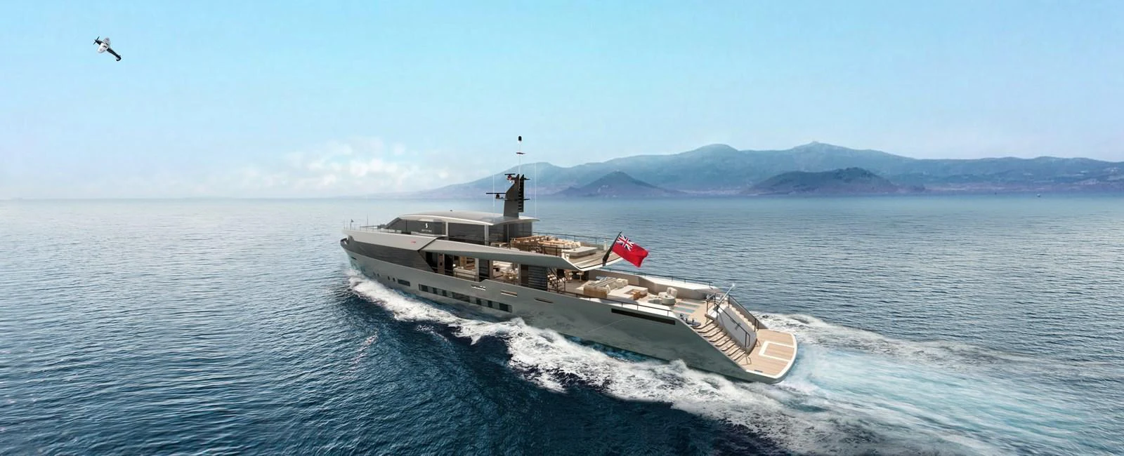 A sleek yacht cruises through open waters with a mountainous backdrop. aboard SPITFIRE Yacht for Sale