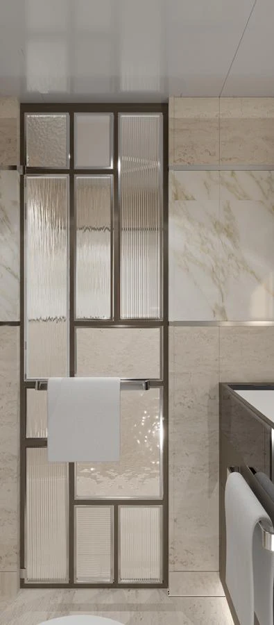 A luxurious bathroom with elegant marble walls and a modern glass partition. aboard SPITFIRE Yacht for Sale