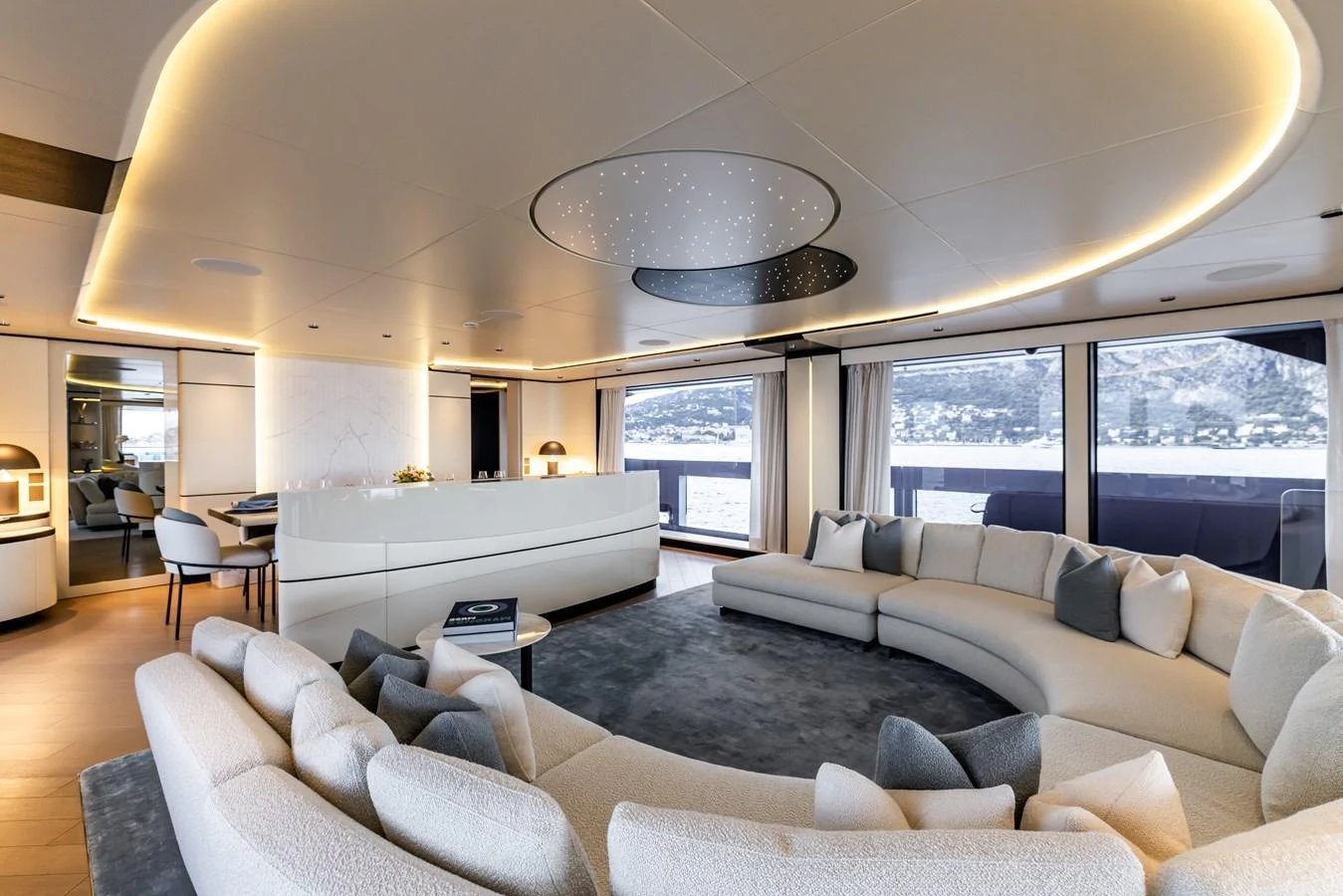 a living room with a large window aboard FELICITA Yacht for Sale
