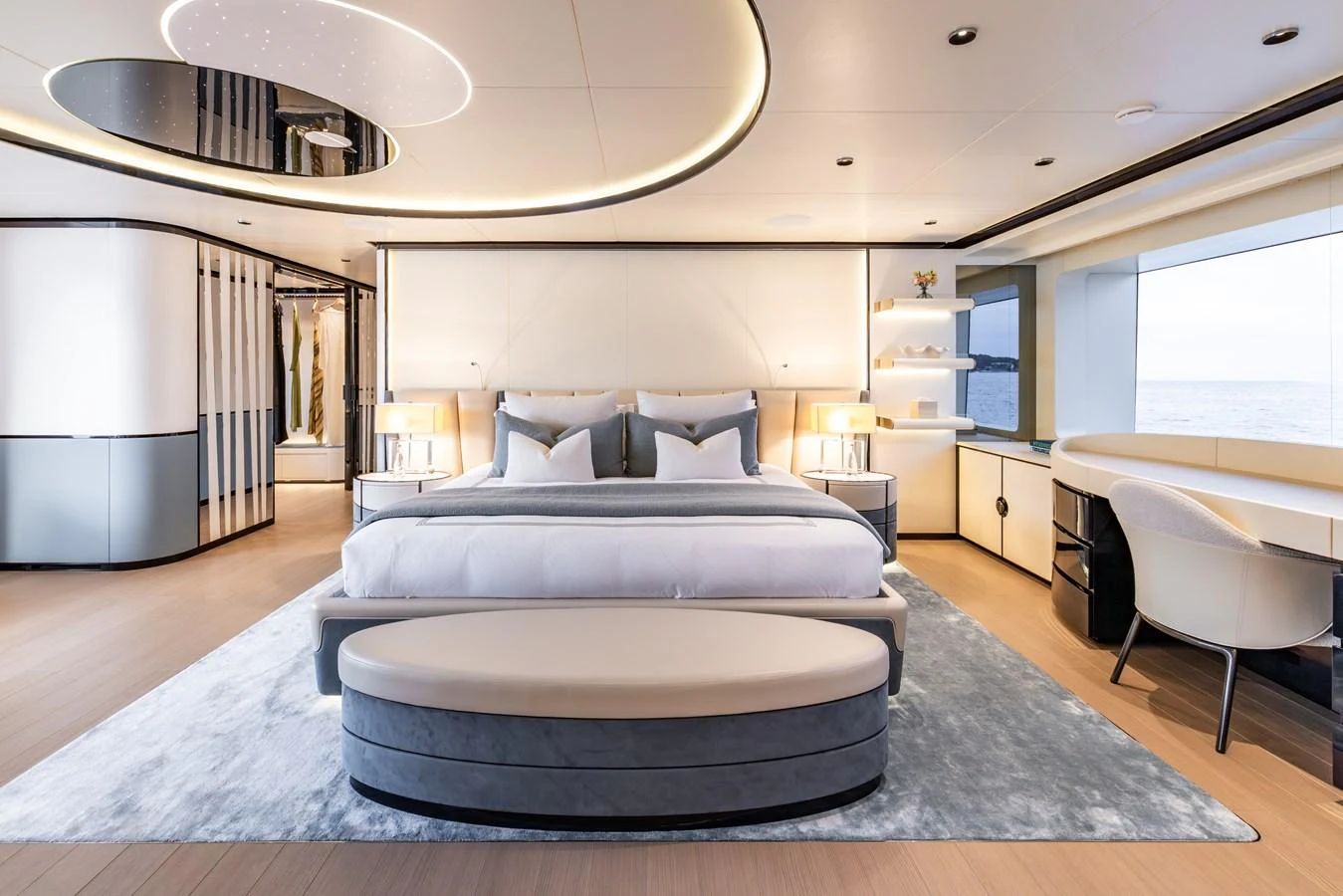 a large living room with a large bed and a large window aboard FELICITA Yacht for Sale