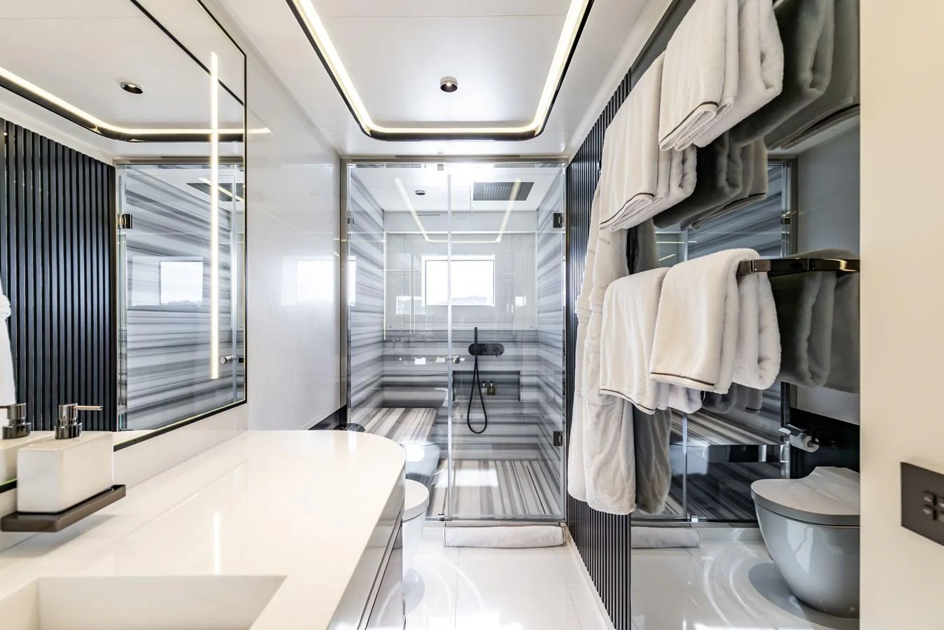 a bathroom with a glass shower aboard FELICITA Yacht for Sale