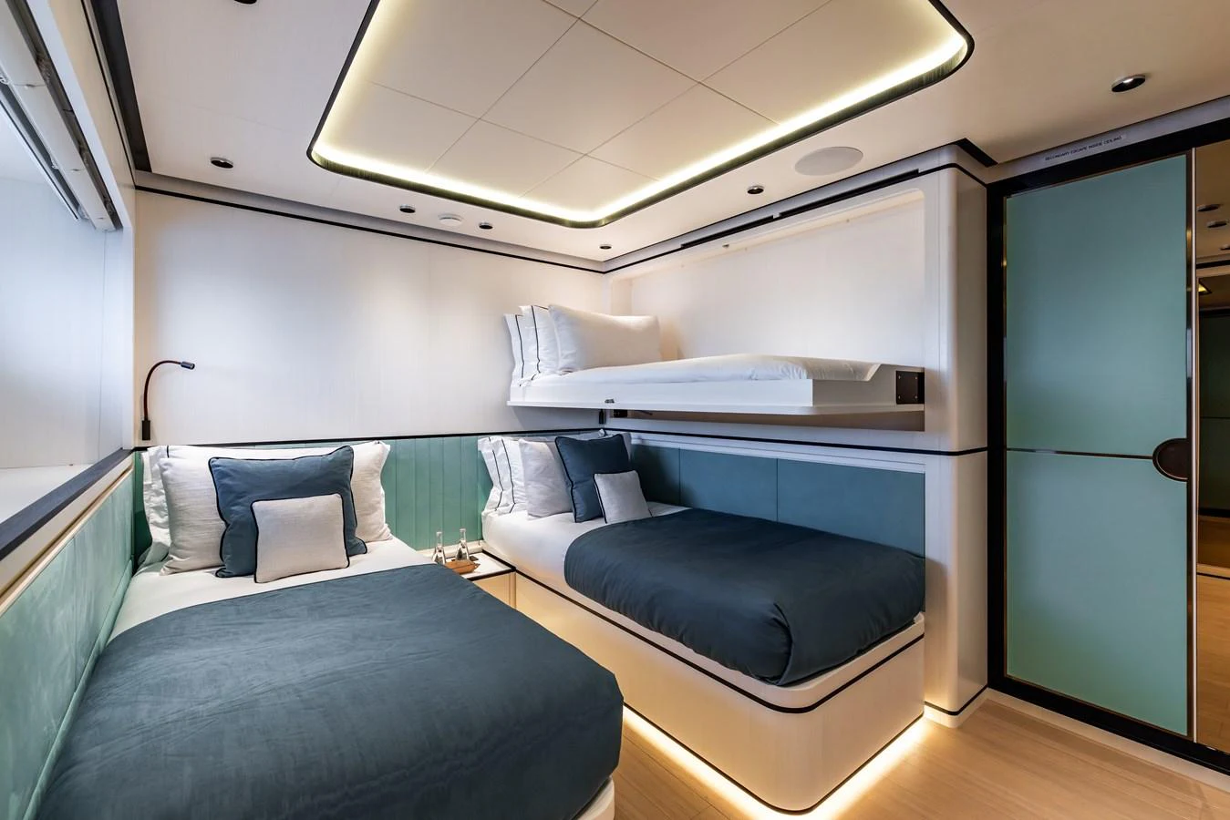 a room with a bed and a desk aboard FELICITA Yacht for Sale