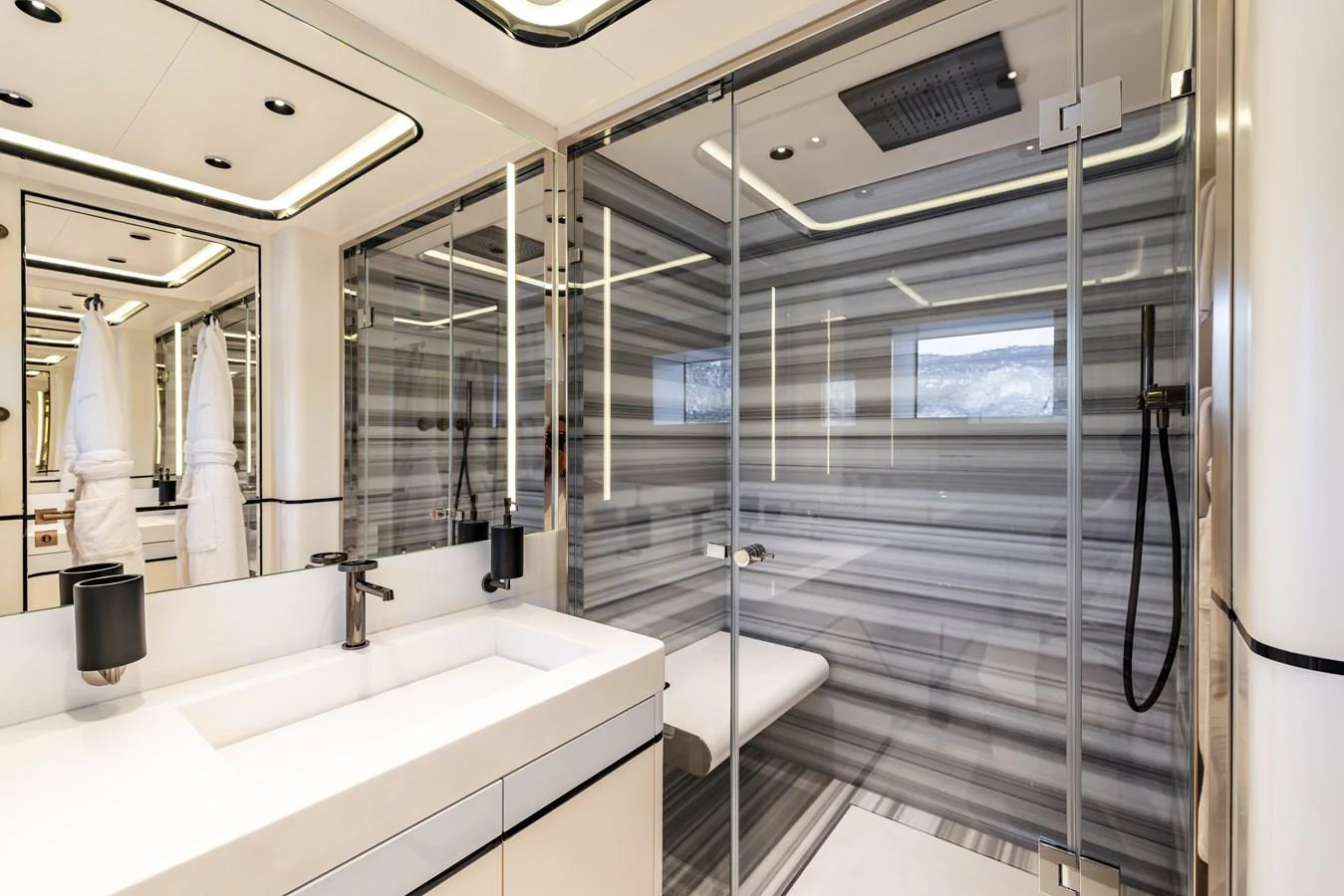 a bathroom with a glass shower aboard FELICITA Yacht for Sale