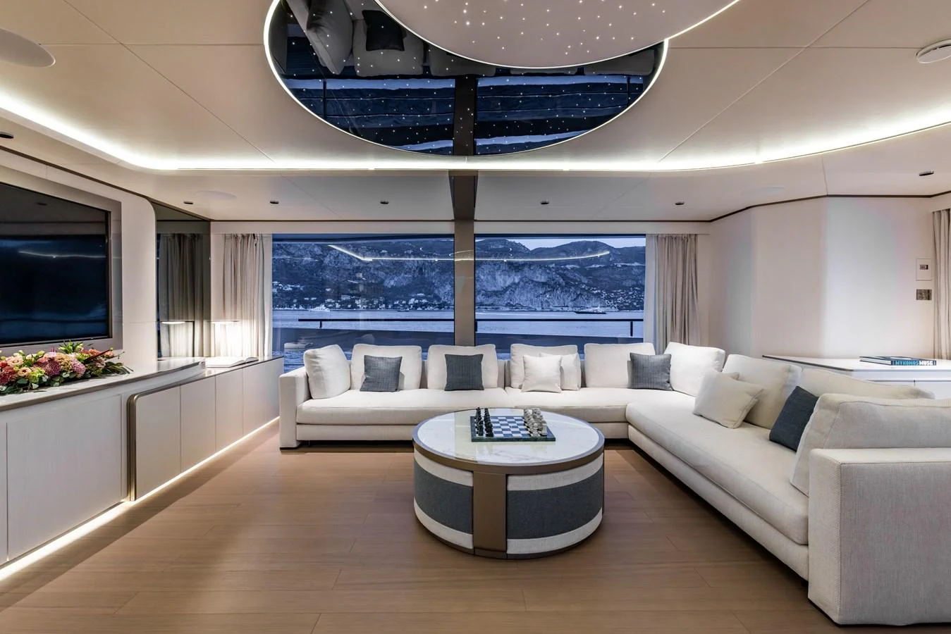 a living room with a large window aboard FELICITA Yacht for Sale