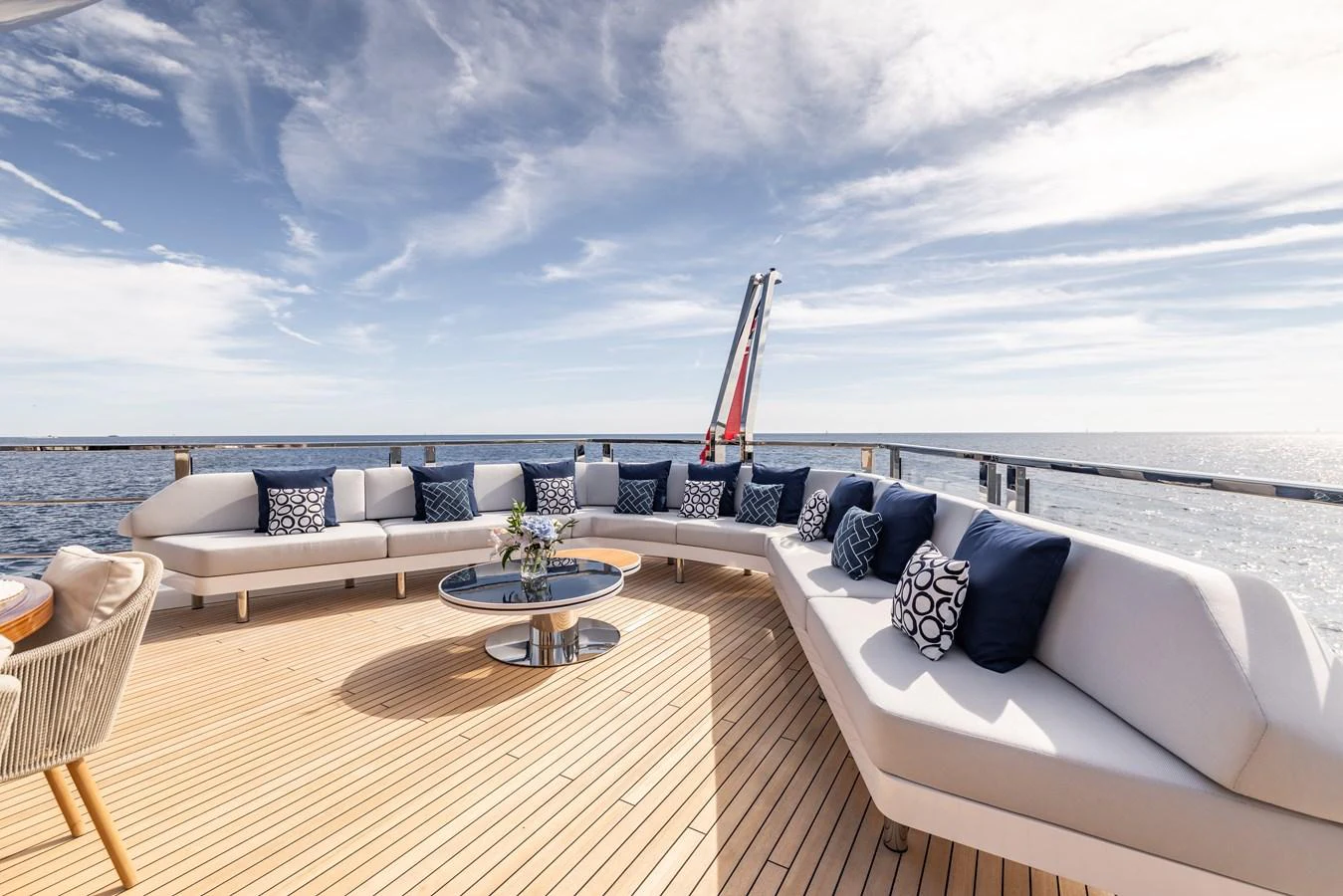 a large white lounge chair on a beach with a large white lounge chair and a large blue sky aboard FELICITA Yacht for Sale