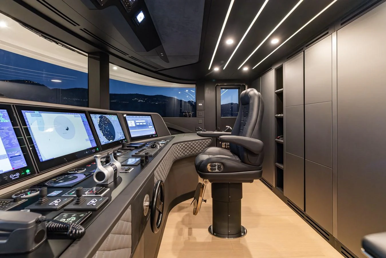 a room with computers and monitors aboard FELICITA Yacht for Sale