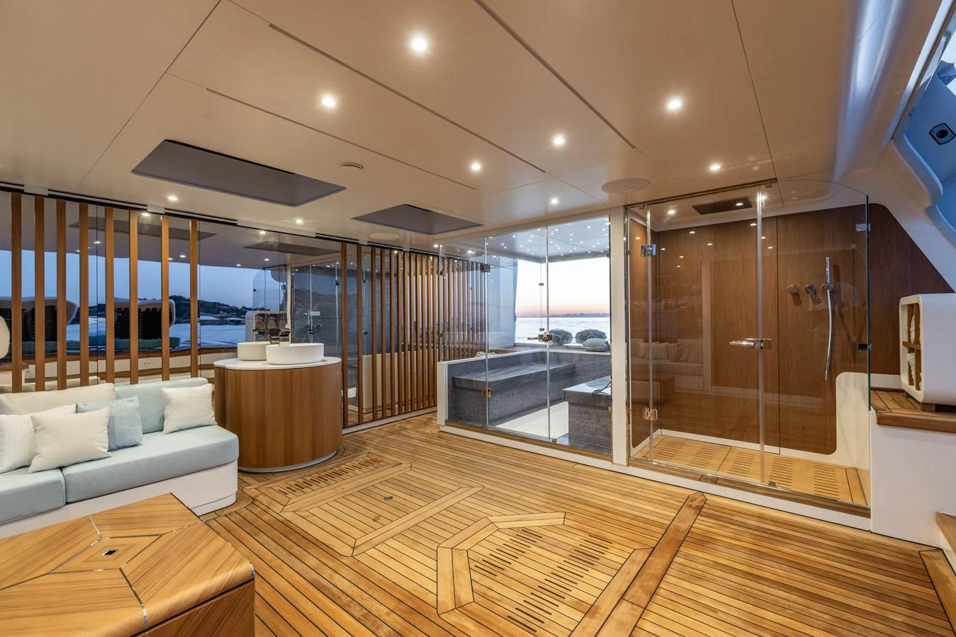 a large room with a wood floor and a large glass window aboard FELICITA Yacht for Sale