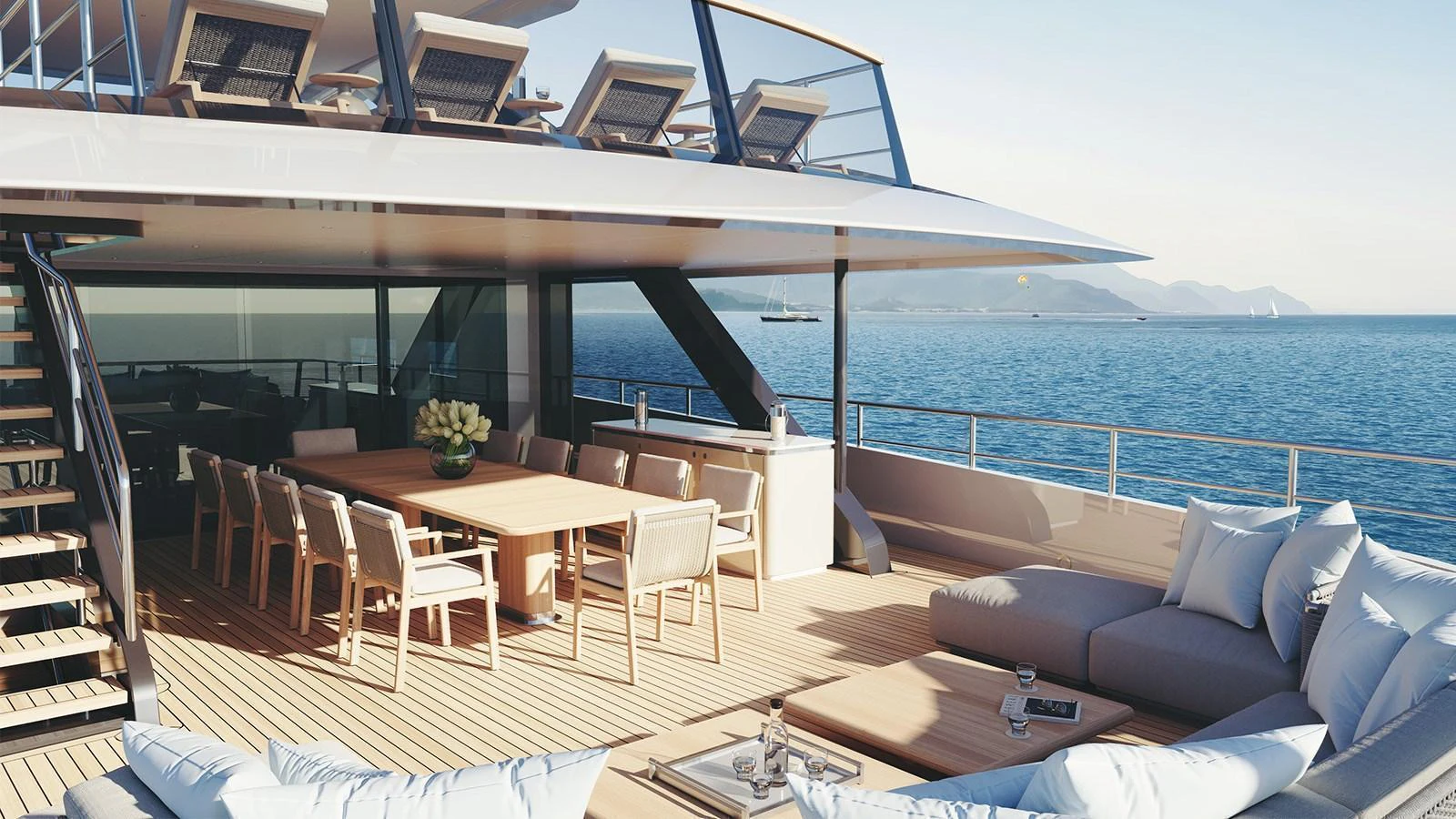 The yacht's aft deck features a spacious dining area and comfortable lounging space with stunning ocean views. aboard HEESEN 50M DISPLACEMENT STEEL ALUMINIUM YN 21350  GRACE Yacht for Sale