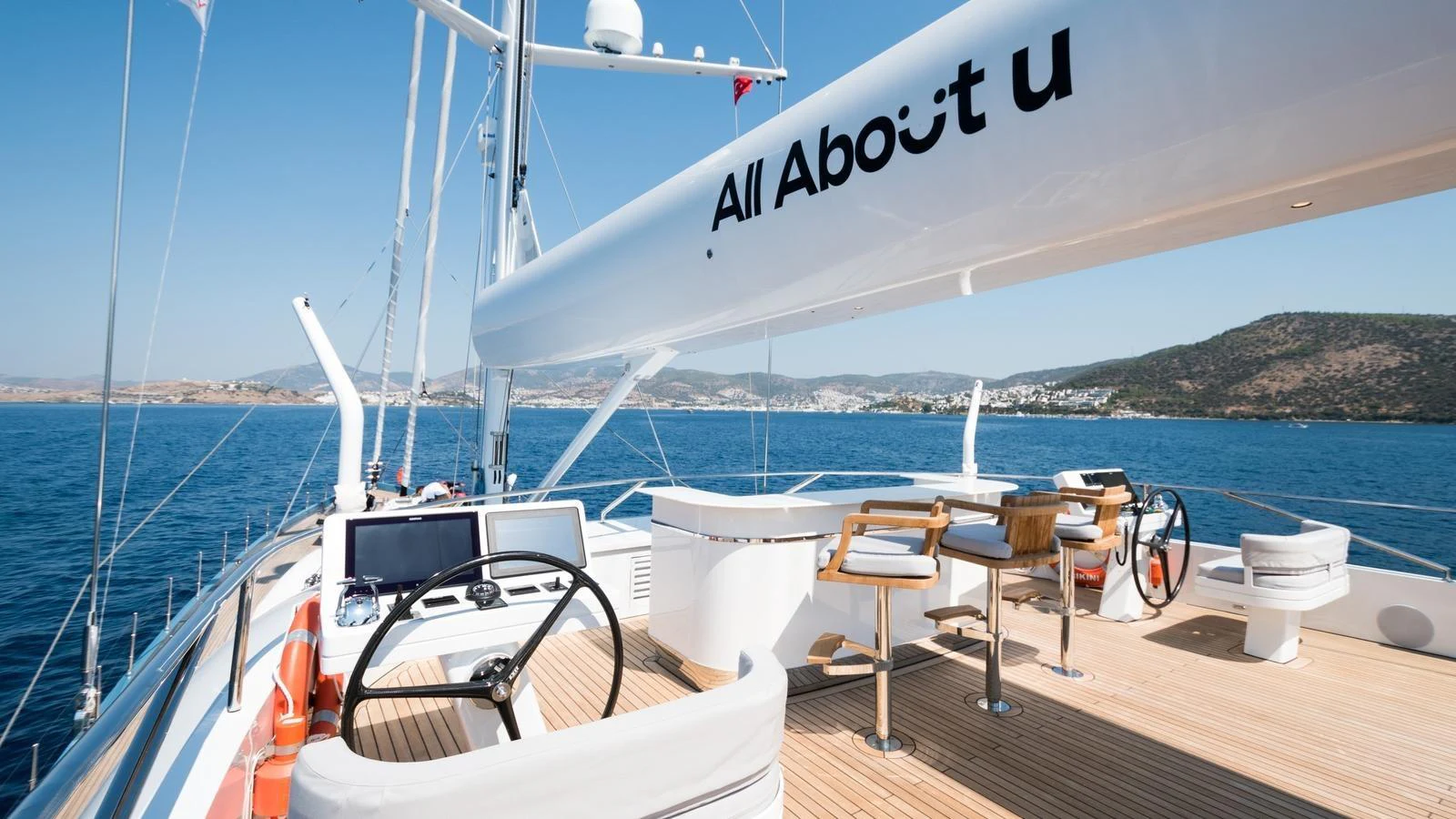 The flybridge offers a spacious and luxurious area for relaxation and navigation with stunning views. aboard ALL ABOUT U Yacht for Sale