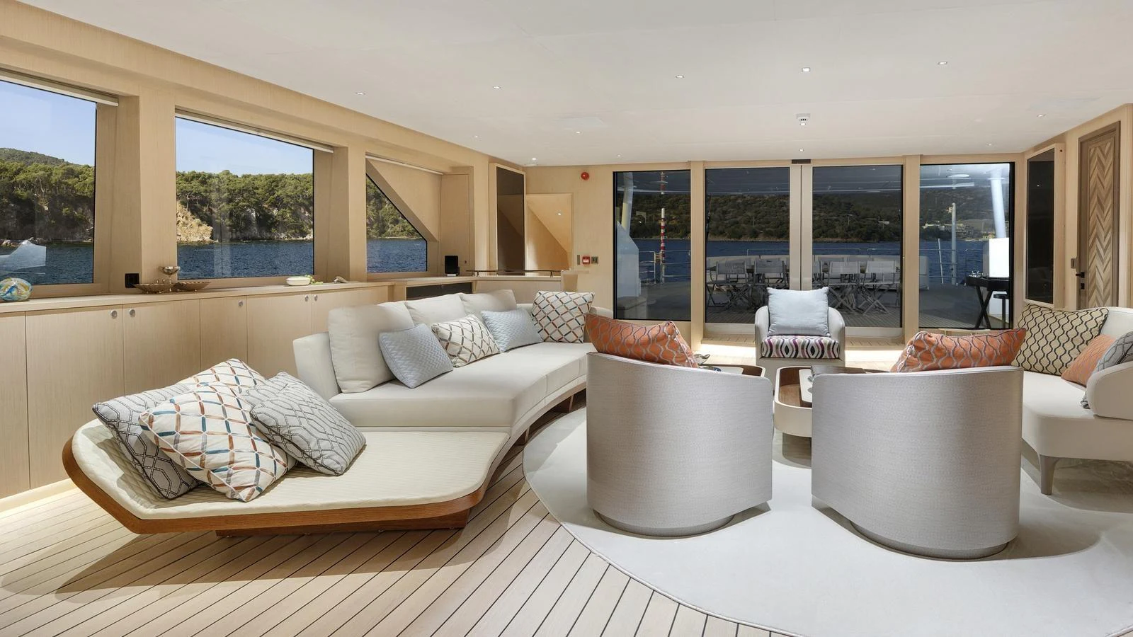 The spacious salon features elegant seating with panoramic views of the surrounding waters. aboard ALL ABOUT U Yacht for Sale