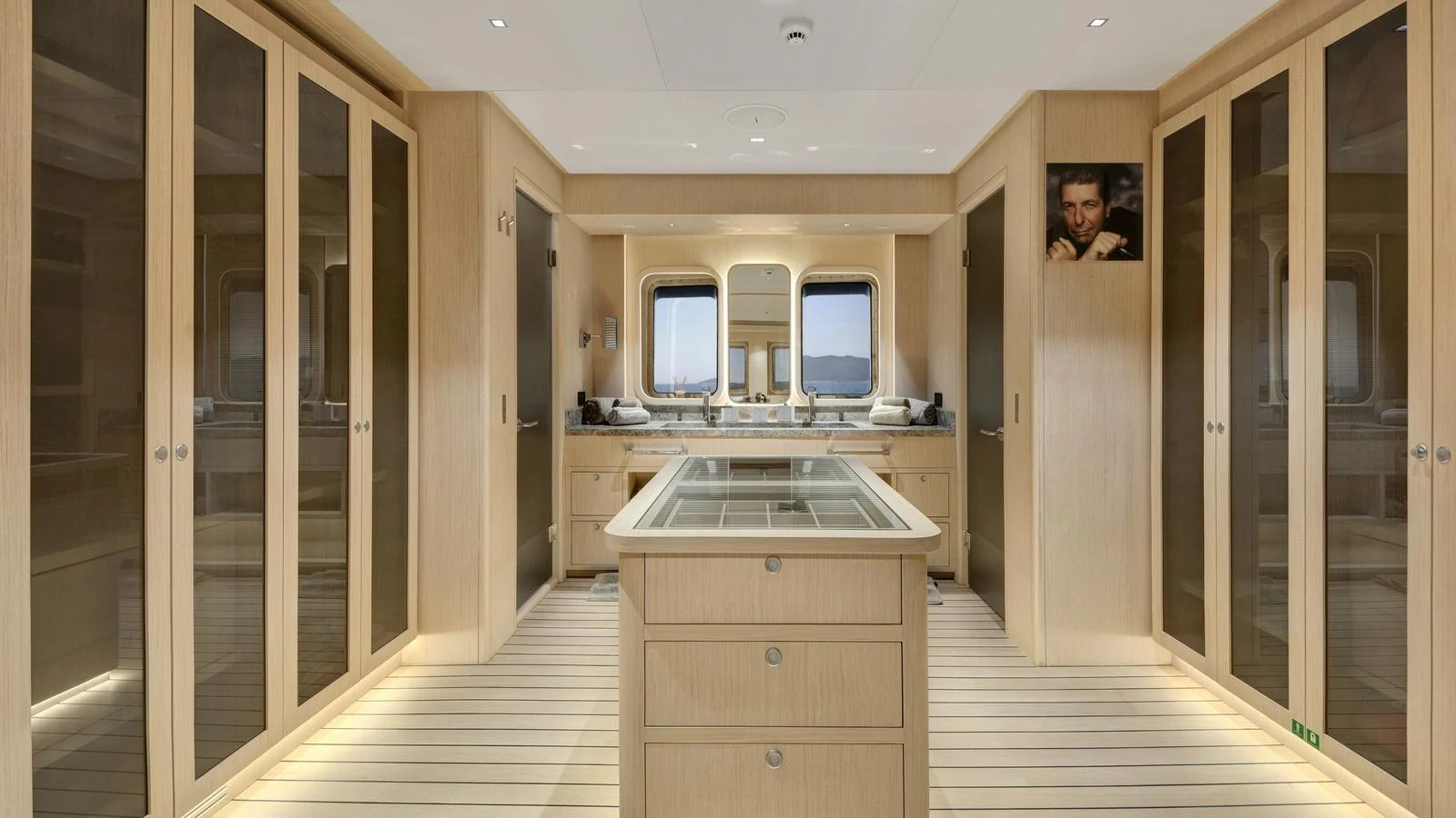 A spacious and elegant interior room with ample storage and a central island. aboard ALL ABOUT U Yacht for Sale