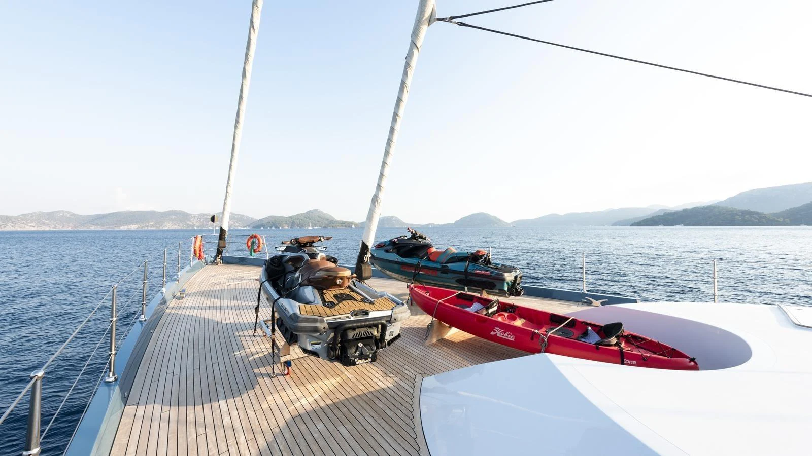 The spacious deck of the yacht features various water toys and offers stunning views of the surrounding seascape. aboard ALL ABOUT U Yacht for Sale