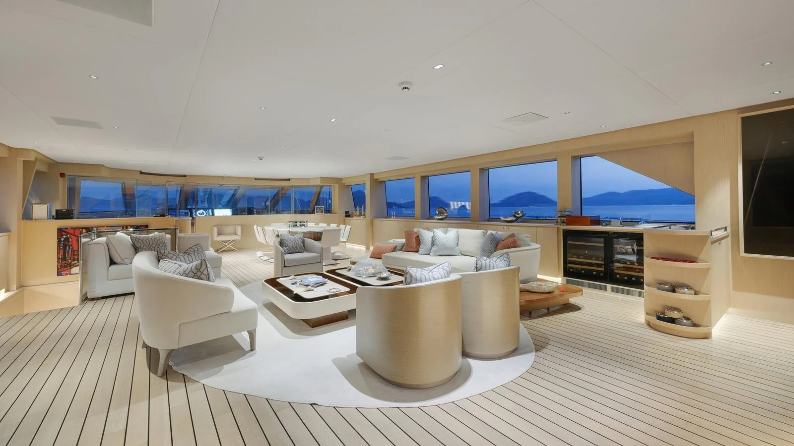 The spacious salon features elegant seating, large windows, and a serene ambiance with panoramic views. aboard ALL ABOUT U Yacht for Sale