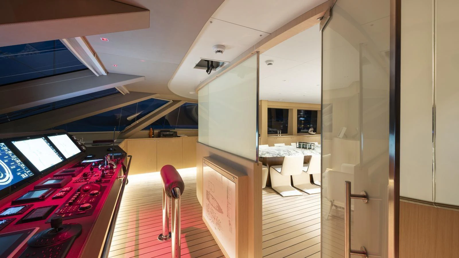 The helm station features advanced navigation equipment and a sleek, modern design. aboard ALL ABOUT U Yacht for Sale