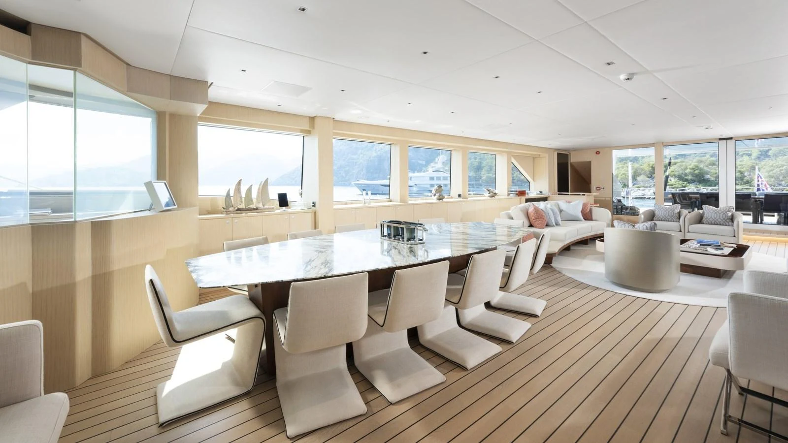 The spacious salon features elegant furnishings and ample natural light. aboard ALL ABOUT U Yacht for Sale