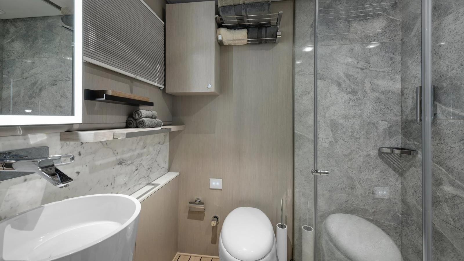 The yacht's bathroom features modern fixtures and a sleek design with marble accents. aboard ALL ABOUT U Yacht for Sale