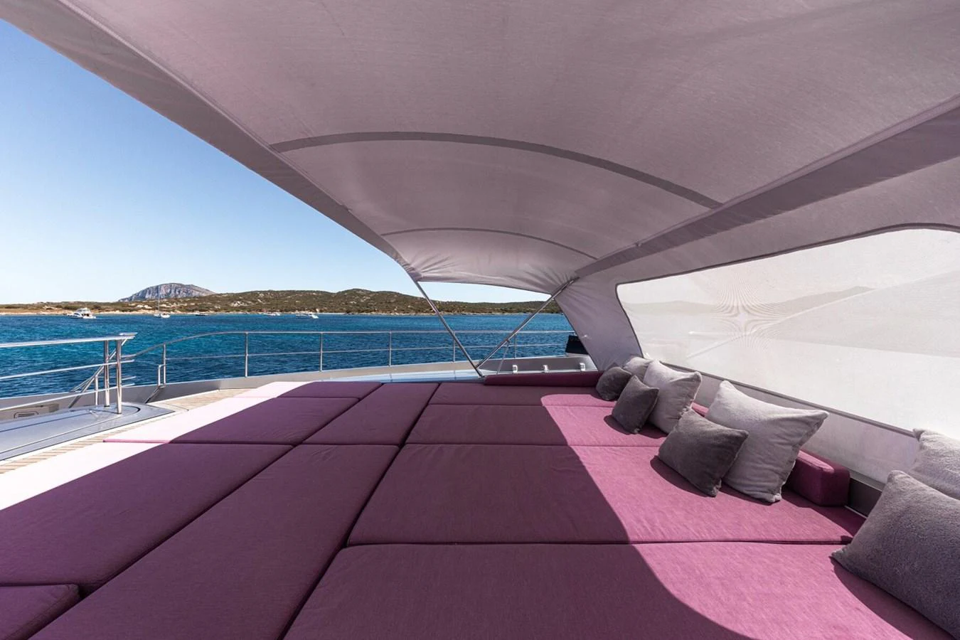 The sundeck offers a luxurious lounging area with ample seating and stunning views of the sea. aboard FLYING DAGGER III Yacht for Sale