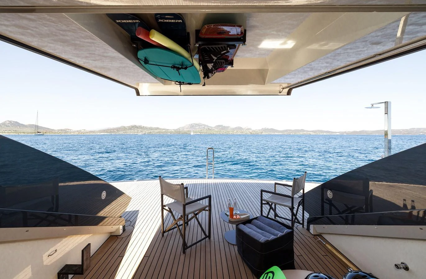 The beach club offers a serene space for relaxation with direct access to the water. aboard FLYING DAGGER III Yacht for Sale