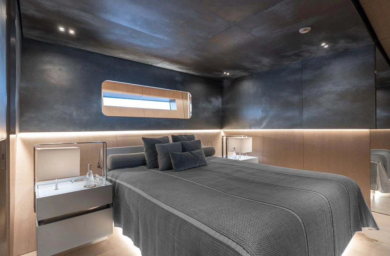 A luxurious stateroom featuring a modern design with sleek lines and ambient lighting. aboard FLYING DAGGER III Yacht for Sale