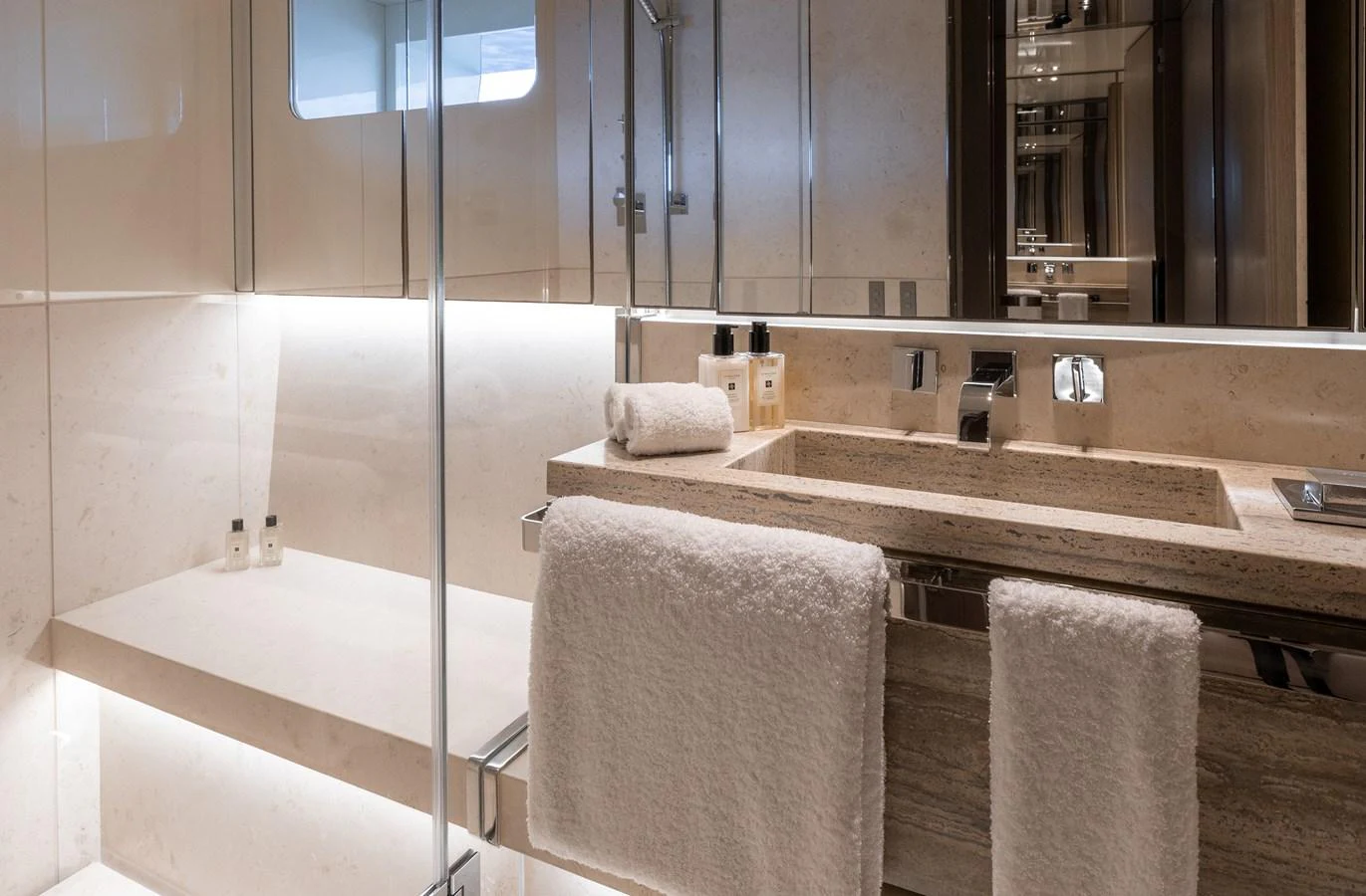 The yacht's bathroom features a sleek, modern design with luxurious amenities and elegant fixtures. aboard FLYING DAGGER III Yacht for Sale