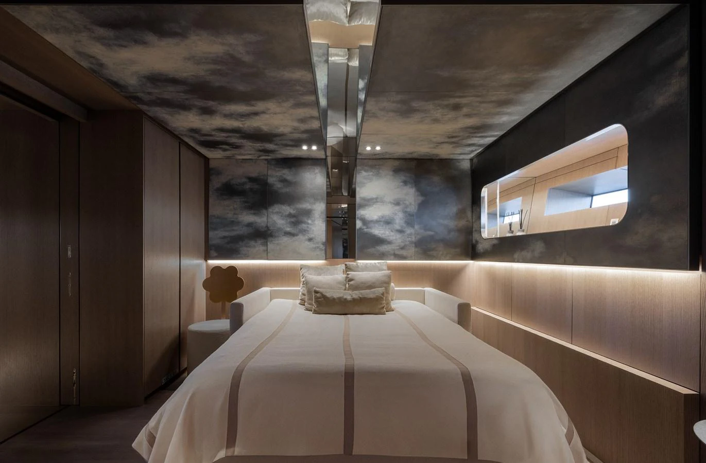 A luxurious stateroom featuring a plush bed and elegant lighting. aboard FLYING DAGGER III Yacht for Sale