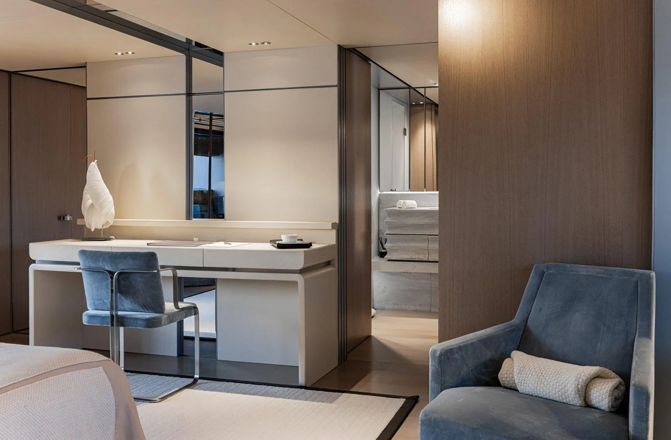 A luxurious stateroom featuring a sleek vanity area and comfortable seating. aboard FLYING DAGGER III Yacht for Sale