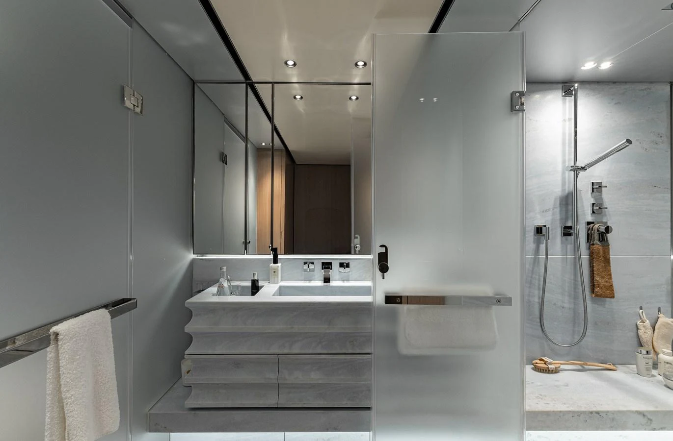 A sleek and modern bathroom with a spacious shower and elegant fixtures. aboard FLYING DAGGER III Yacht for Sale