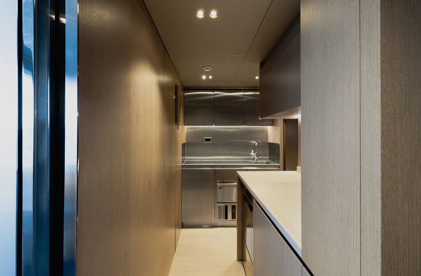 The sleek and modern galley features stainless steel appliances and ample counter space. aboard FLYING DAGGER III Yacht for Sale