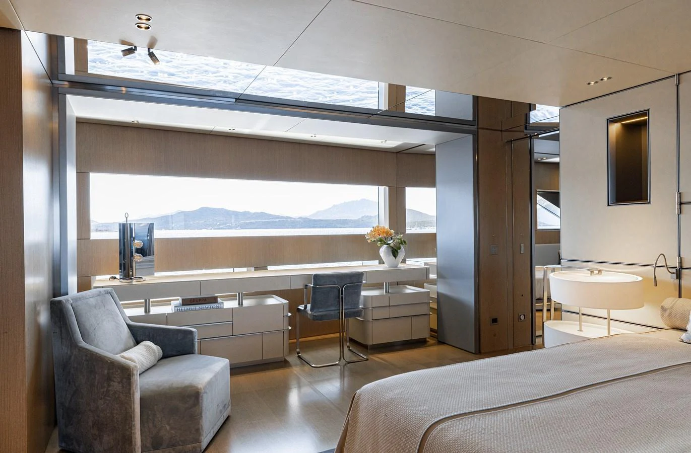 The master stateroom features a spacious layout with large windows offering stunning views. aboard FLYING DAGGER III Yacht for Sale