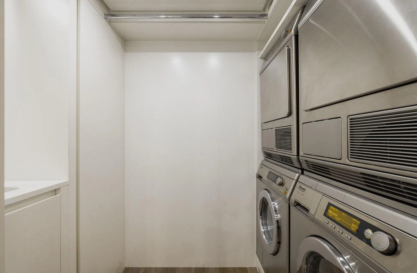 The yacht features a well-equipped laundry room with modern appliances. aboard FLYING DAGGER III Yacht for Sale