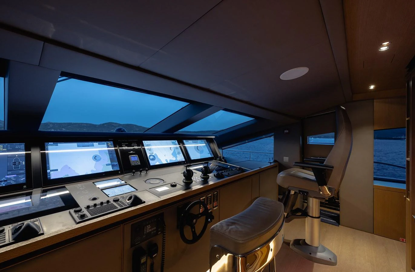 The helm station offers a sophisticated and modern control area with advanced navigation equipment. aboard FLYING DAGGER III Yacht for Sale