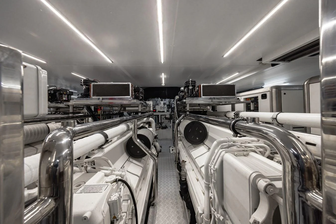 The image showcases the yacht's pristine engine room with advanced machinery and equipment. aboard FLYING DAGGER III Yacht for Sale
