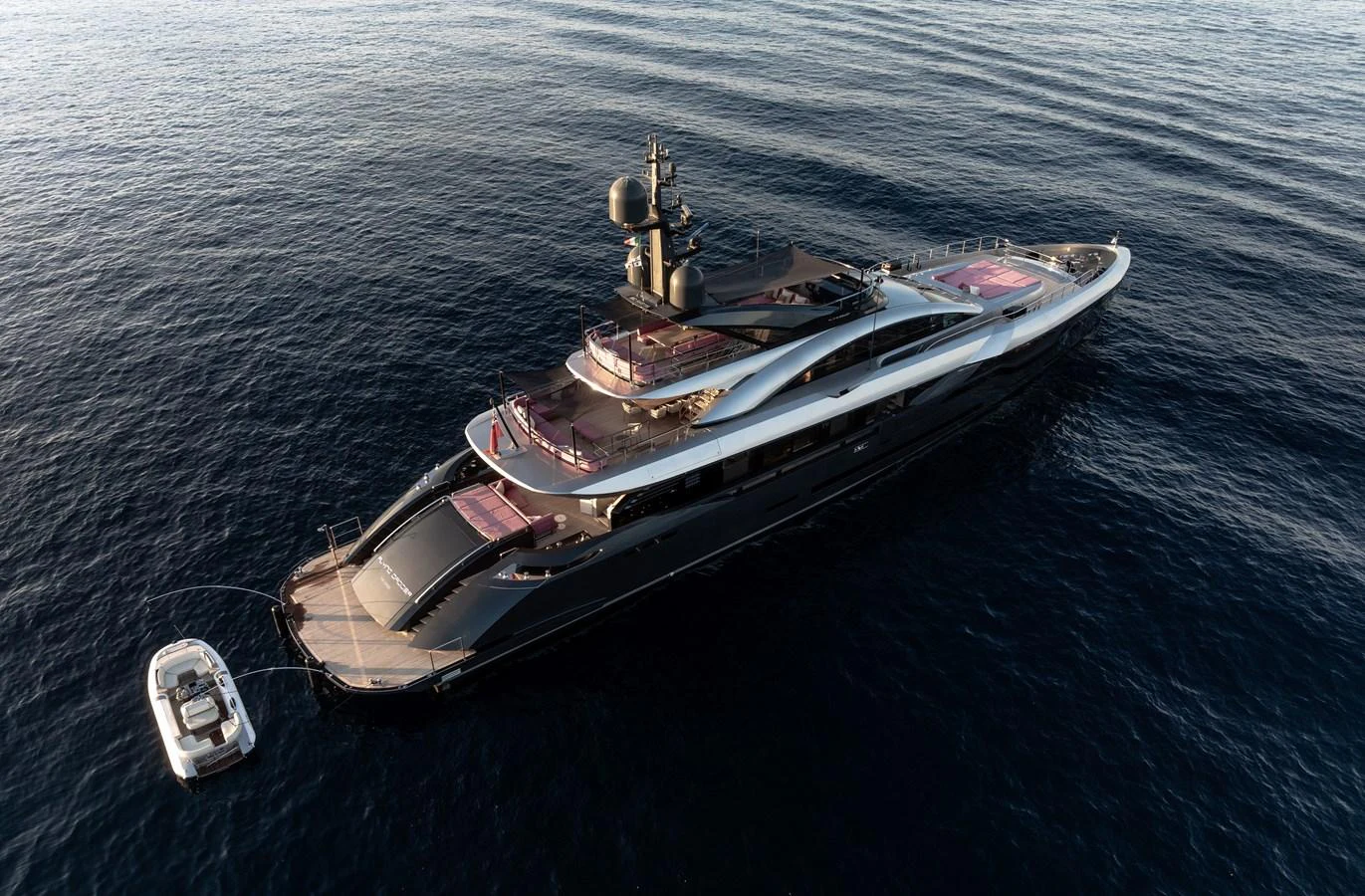 A sleek and modern yacht cruising on calm waters, showcasing its luxurious design and spacious decks. aboard FLYING DAGGER III Yacht for Sale
