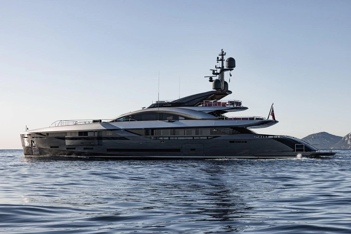 A sleek and modern yacht glides gracefully on calm waters, showcasing its elegant design and luxurious features. aboard FLYING DAGGER III Yacht for Sale